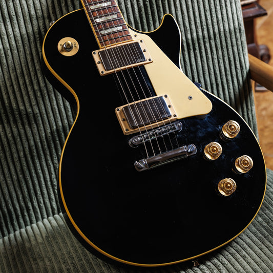 Black 2008 Gibson Les Paul Traditional, a clean player-grade guitar with factory pickups swapped for active EMGs