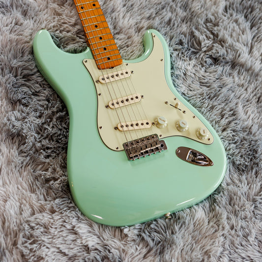 Surf Green Fender Stratocaster showing three single-coil pickups, five-way switch and tremolo bridge