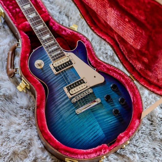 Gibson Les Paul Traditional Pro V in Blueberry Burst in an open case, illustrating unit-to-unit variation between identical guitar models.