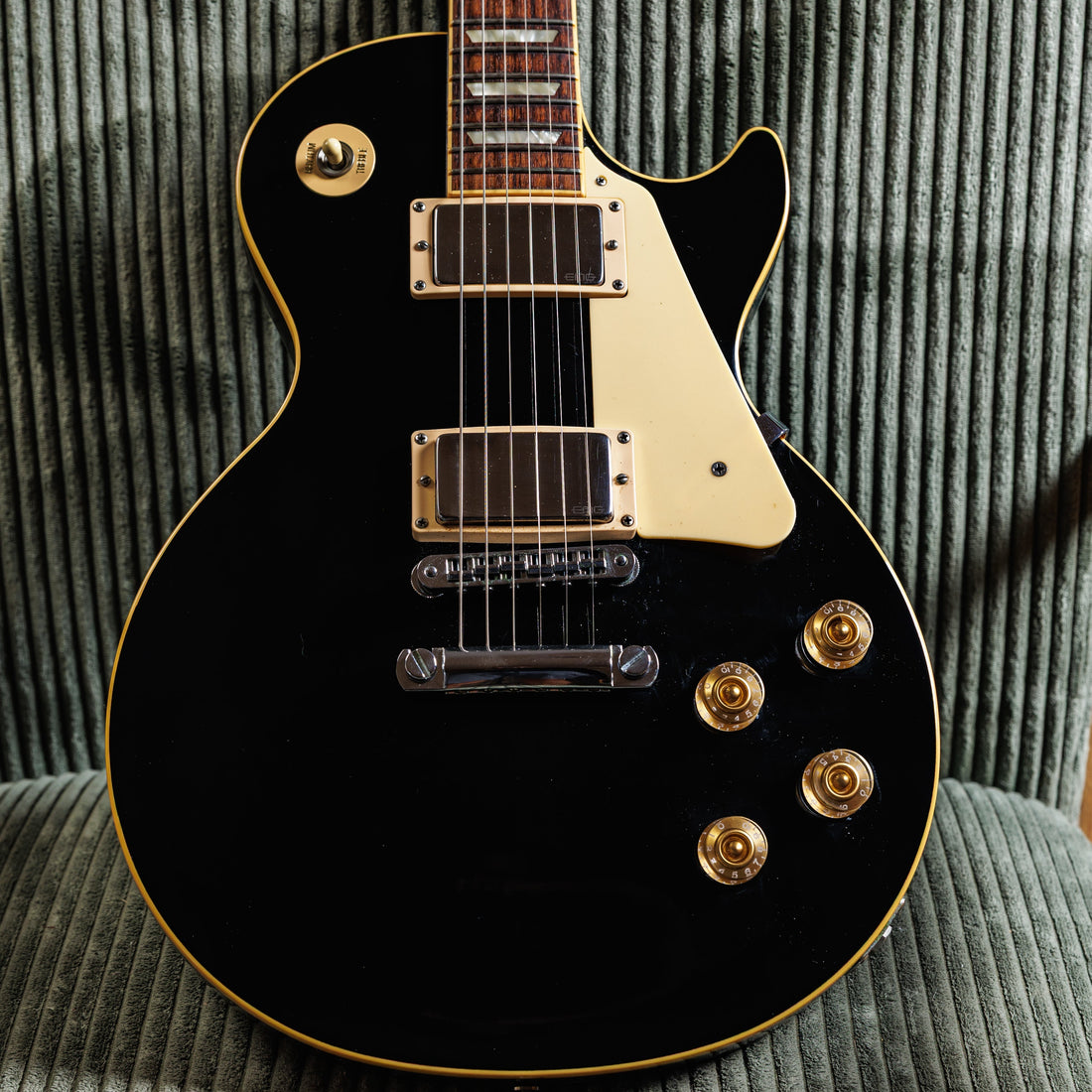 Gibson Les Paul Traditional in ebony fitted with aftermarket EMG active pickups, an example of a reversible modification on a used guitar
