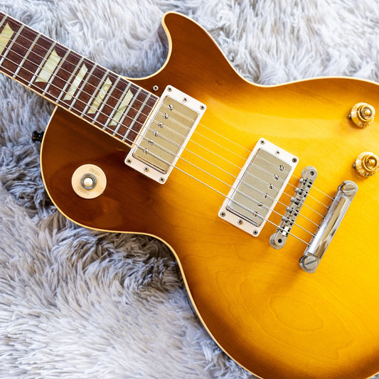 Neck and fretboard of a used 1997 Gibson Les Paul Classic on the bench, the first area to inspect when buying a used guitar