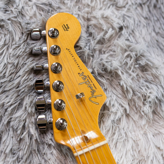 Front of a Fender American Professional II Stratocaster headstock showing a single string tree retaining the B and high-E strings.