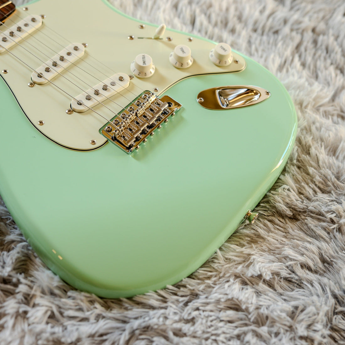 Vintage six-screw synchronized tremolo bridge on a Surf Green Fender Stratocaster, the hardware at the center of the float versus block debate