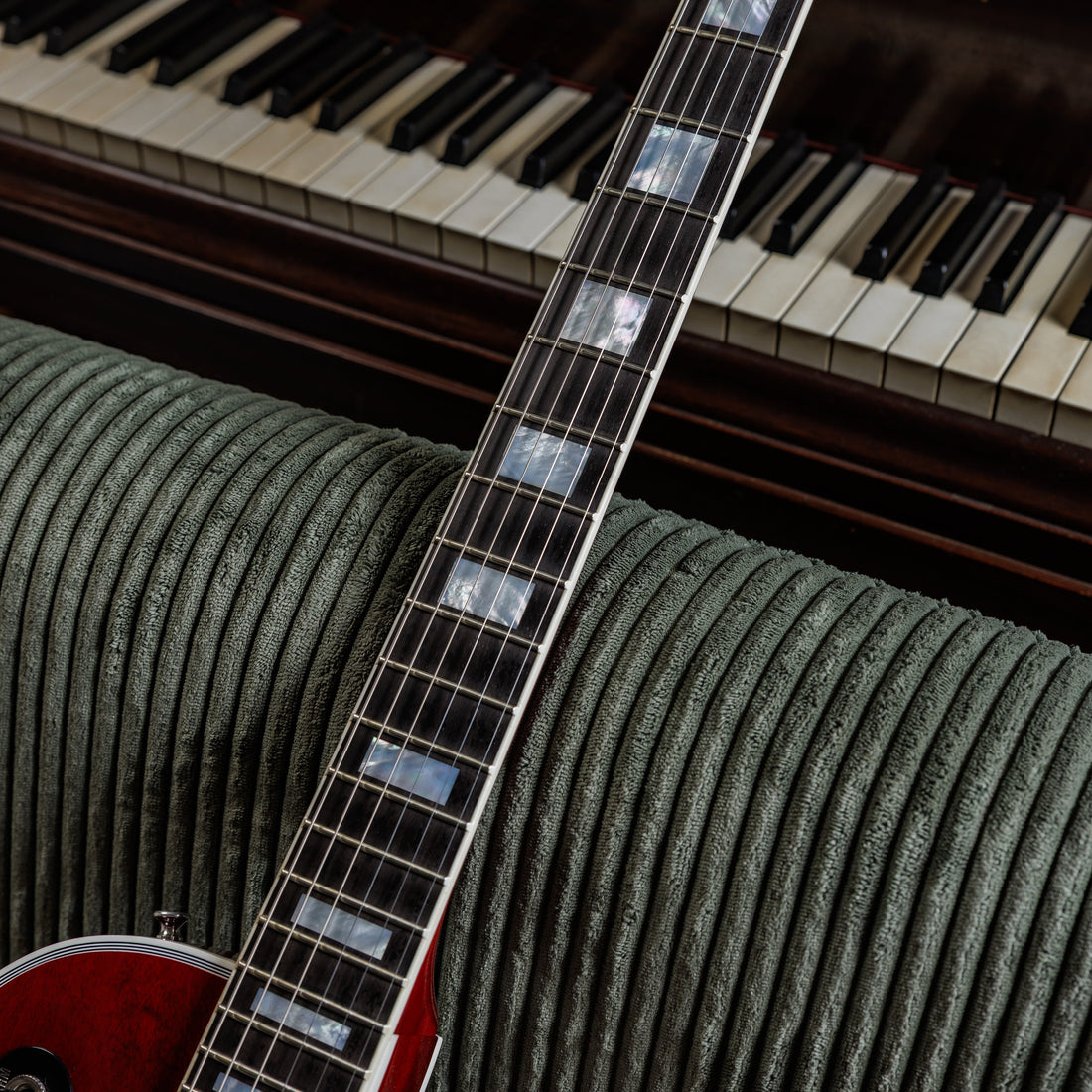 Close-up of the fretboard and frets on a Gibson Les Paul Custom, the part of the guitar a setup dials in
