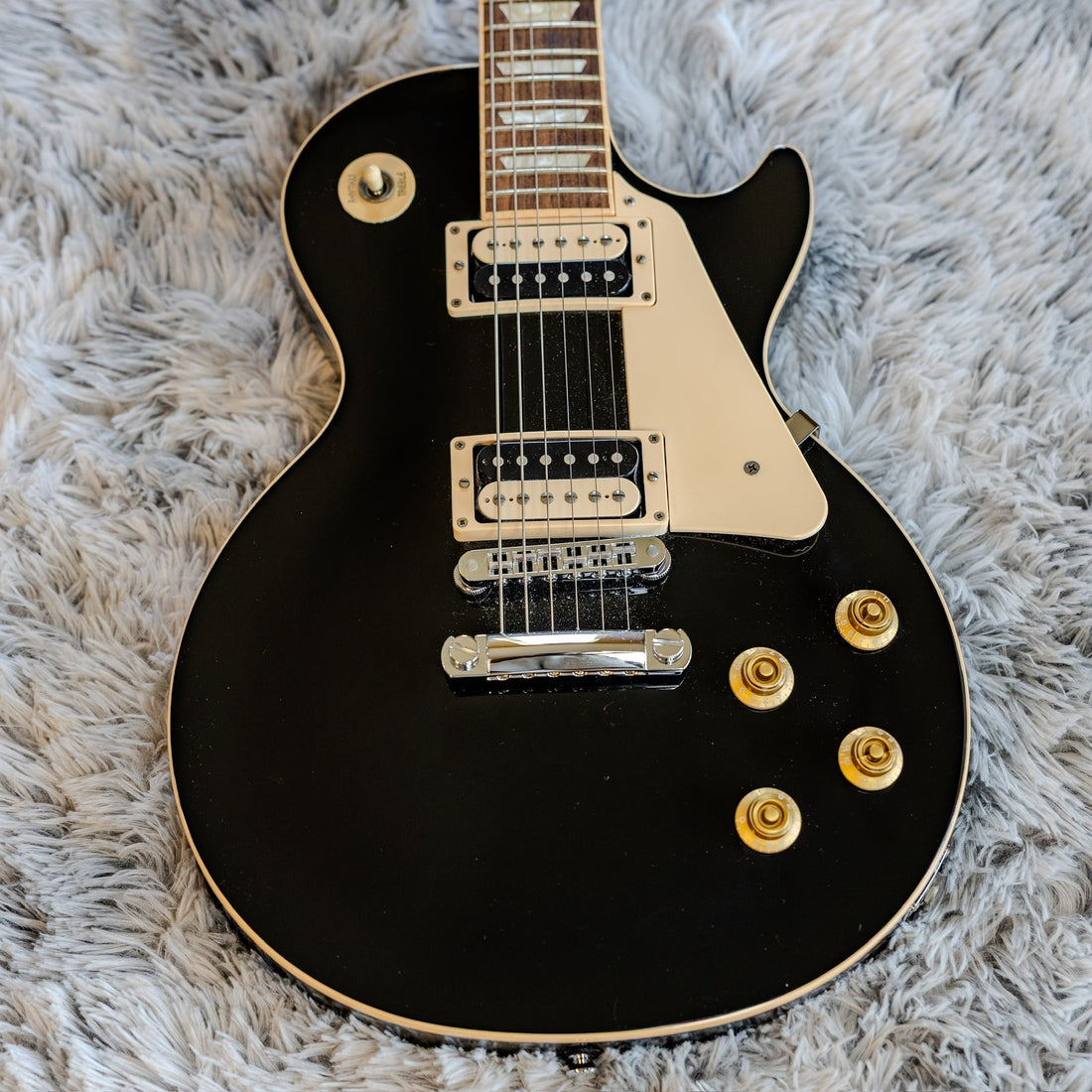 Gibson Les Paul Traditional Pro showing its stock humbuckers, illustrating a used guitar pickup swap question
