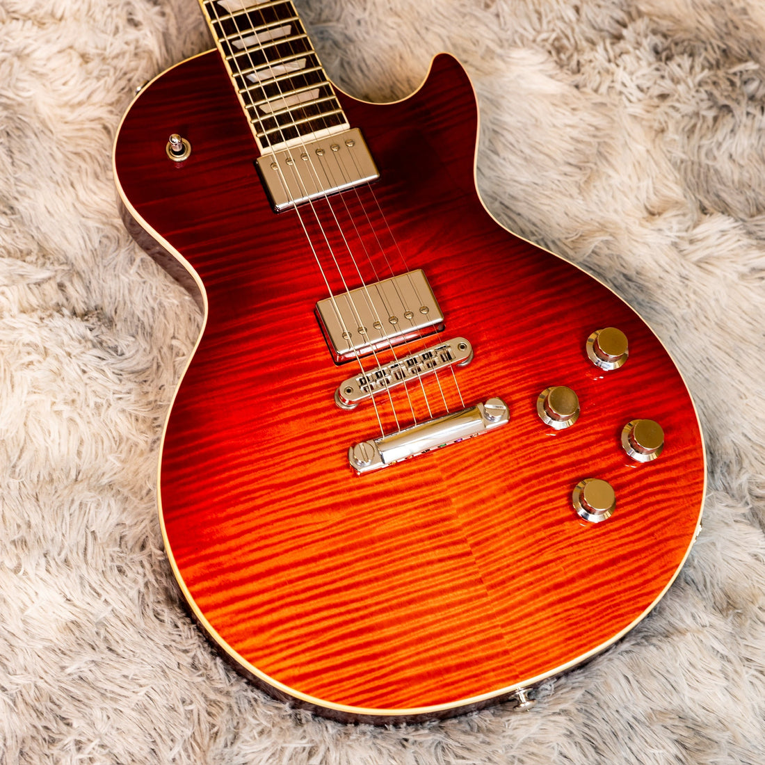 Used Gibson Les Paul in Heritage Cherry, a set-neck carved-top guitar with a tune-o-matic bridge where neck angle matters when buying used