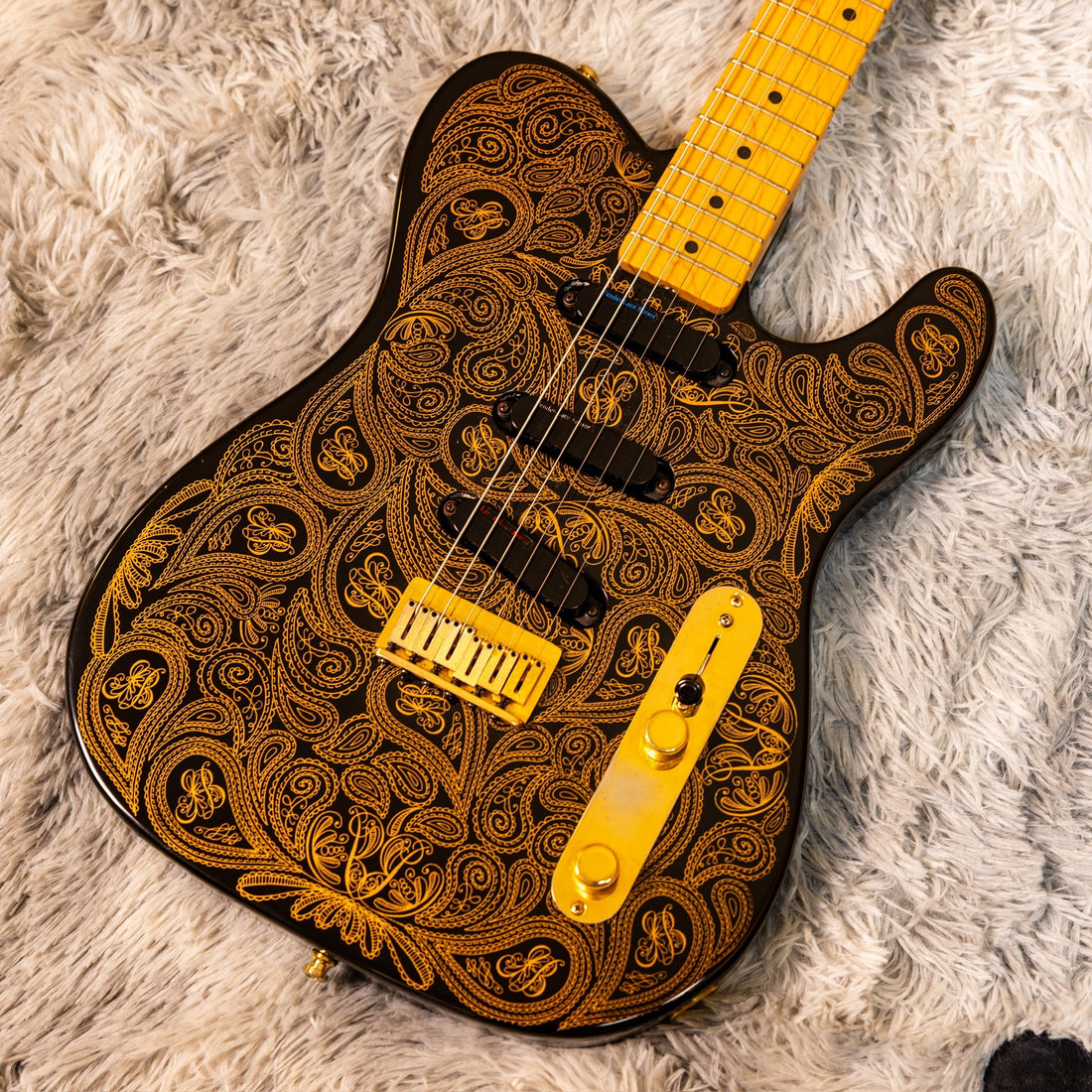 Fender James Burton Signature Telecaster in black with gold paisley finish showing three Lace Sensor pickups