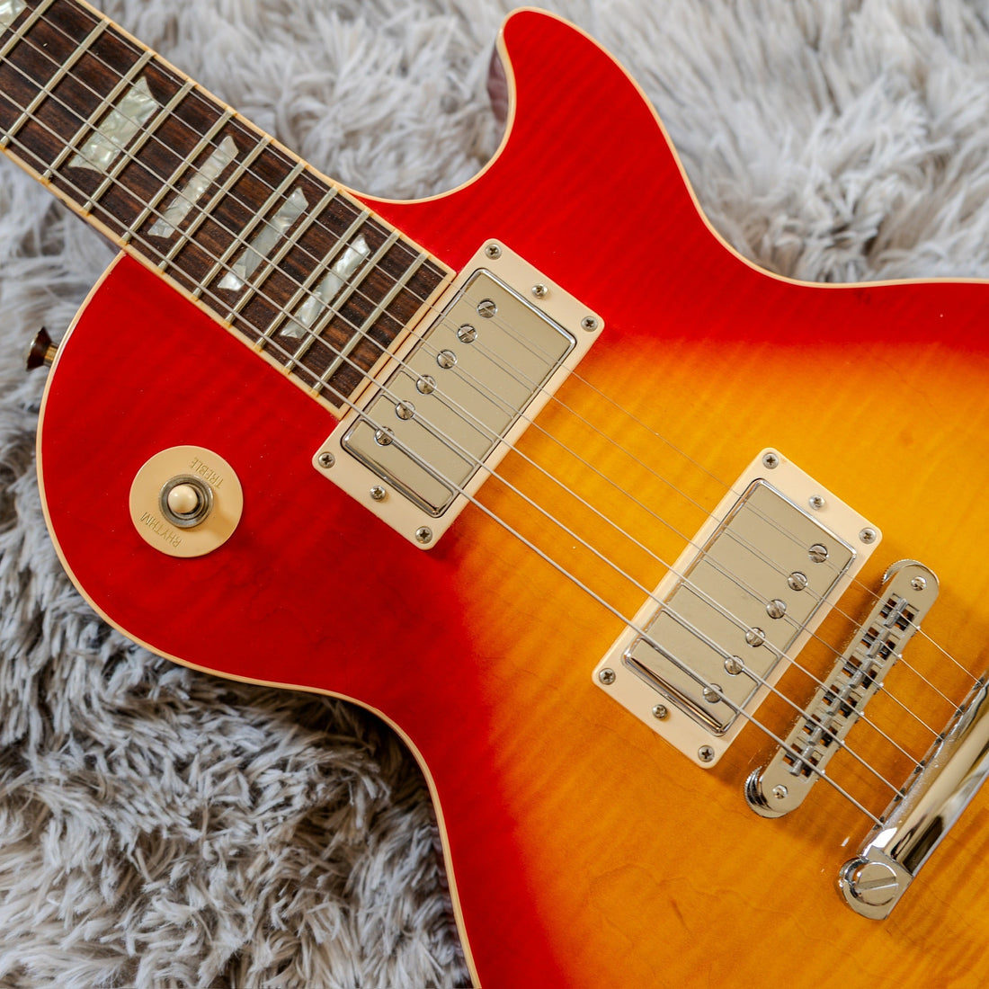 Genuine fine nitrocellulose finish checking across the top of a 1990s Gibson Les Paul Standard Plus in cherry sunburst