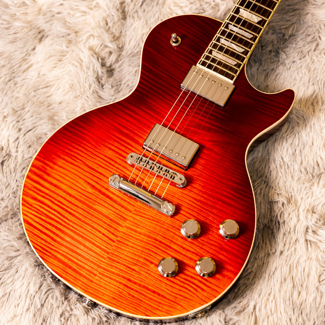 Gibson Les Paul body showing two humbuckers, four control knobs, and the three-way toggle switch