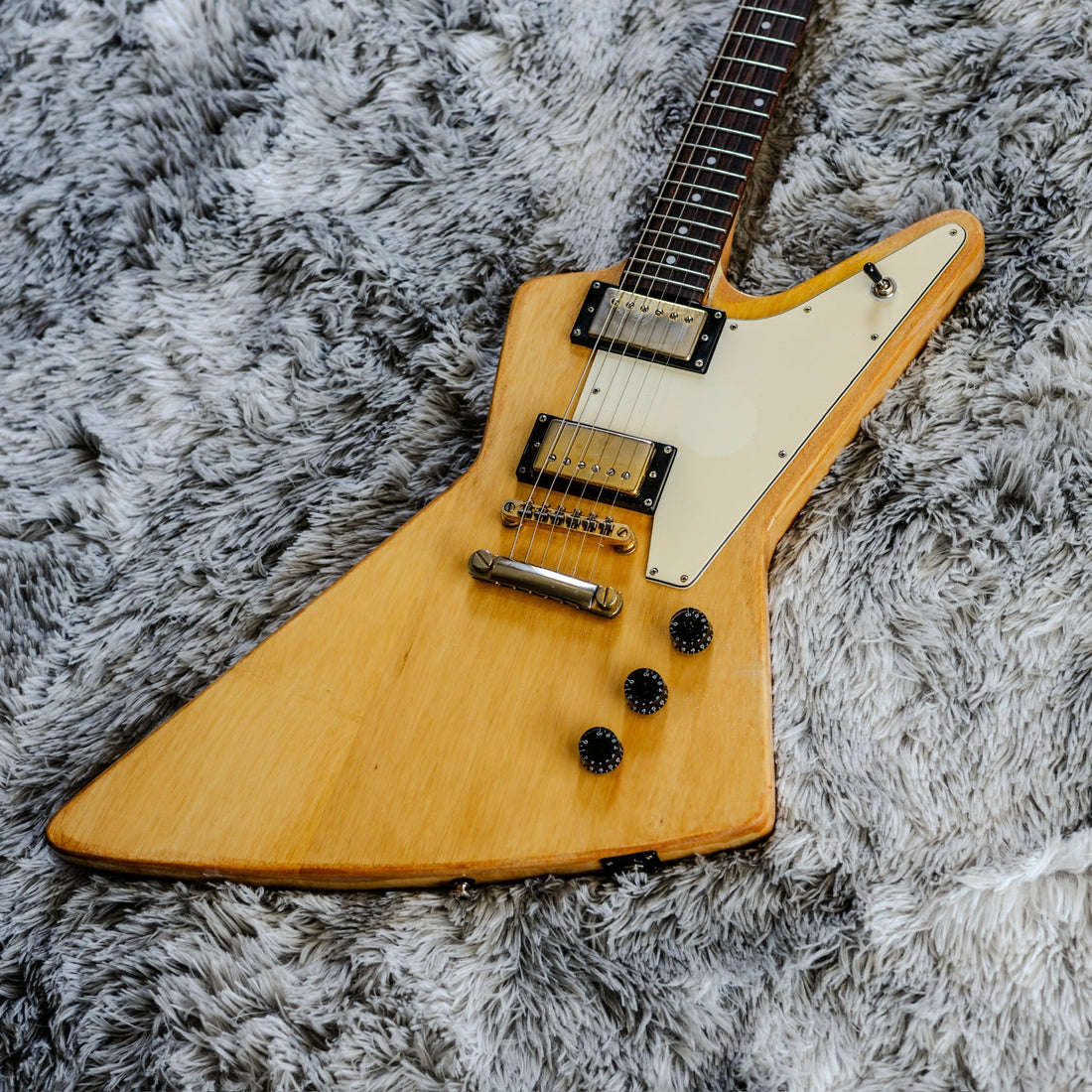 Natural korina-finished Explorer showing the classic angular Gibson Explorer body shape