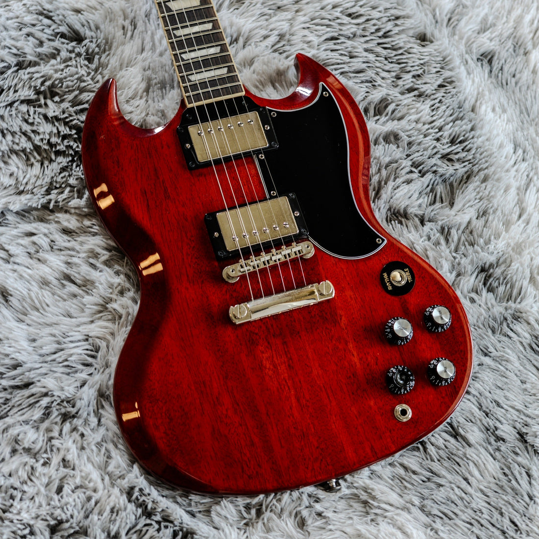 Gibson SG Standard '61 in Vintage Cherry, showing the thin mahogany body and long neck behind SG neck dive