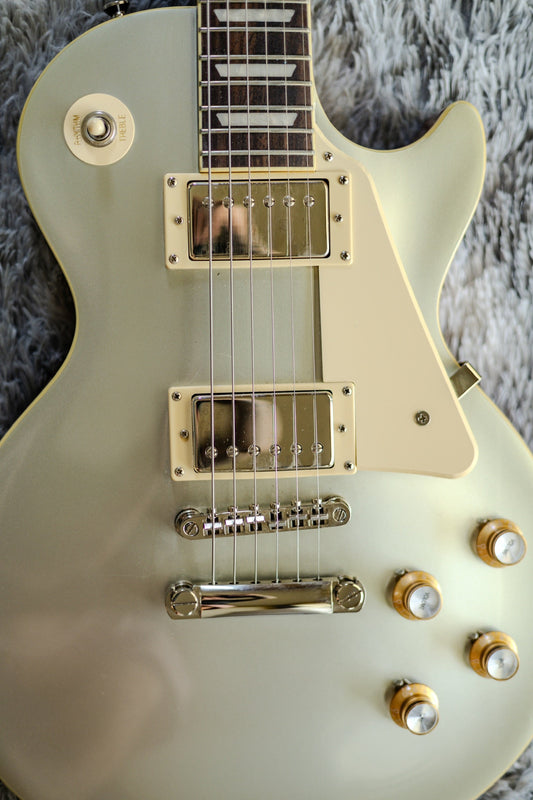 A modern Epiphone Les Paul Standard with alnico ProBucker humbuckers and gold top-hat knobs, the kind of guitar players ask about upgrading