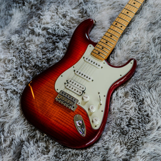 HSS Stratocaster with a bridge humbucker and two single-coil pickups on a cherry burst flame maple body